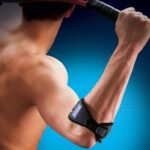 Thuasne Sport Tennisarm Elleboogbrace Aangtrokken Man